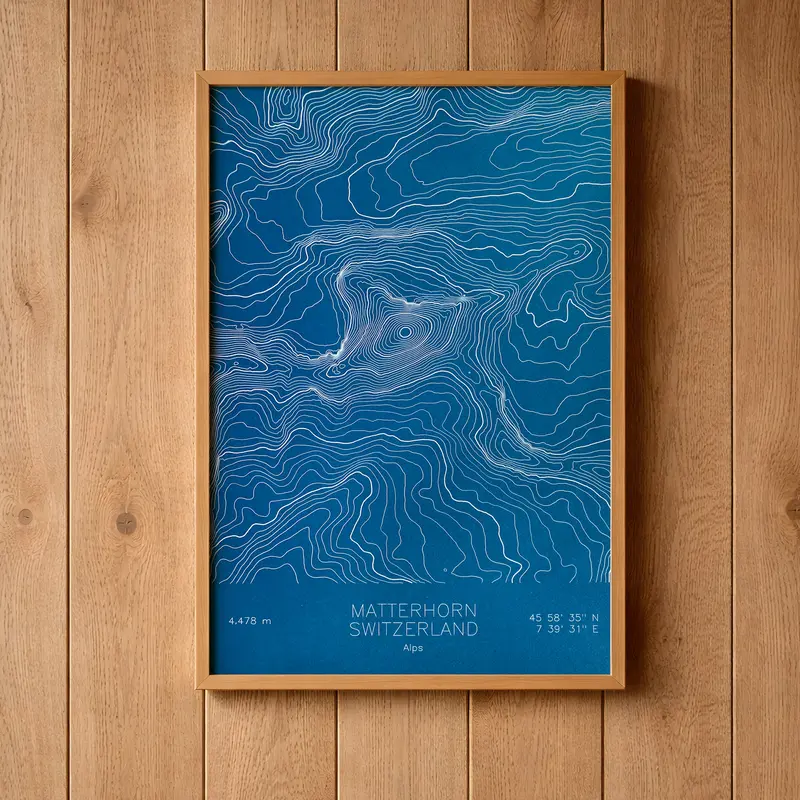 Framed pen-plotted topographic map in the blue colorway displayed in a real room, from the same series as this topographic map of Borah Peak, Idaho